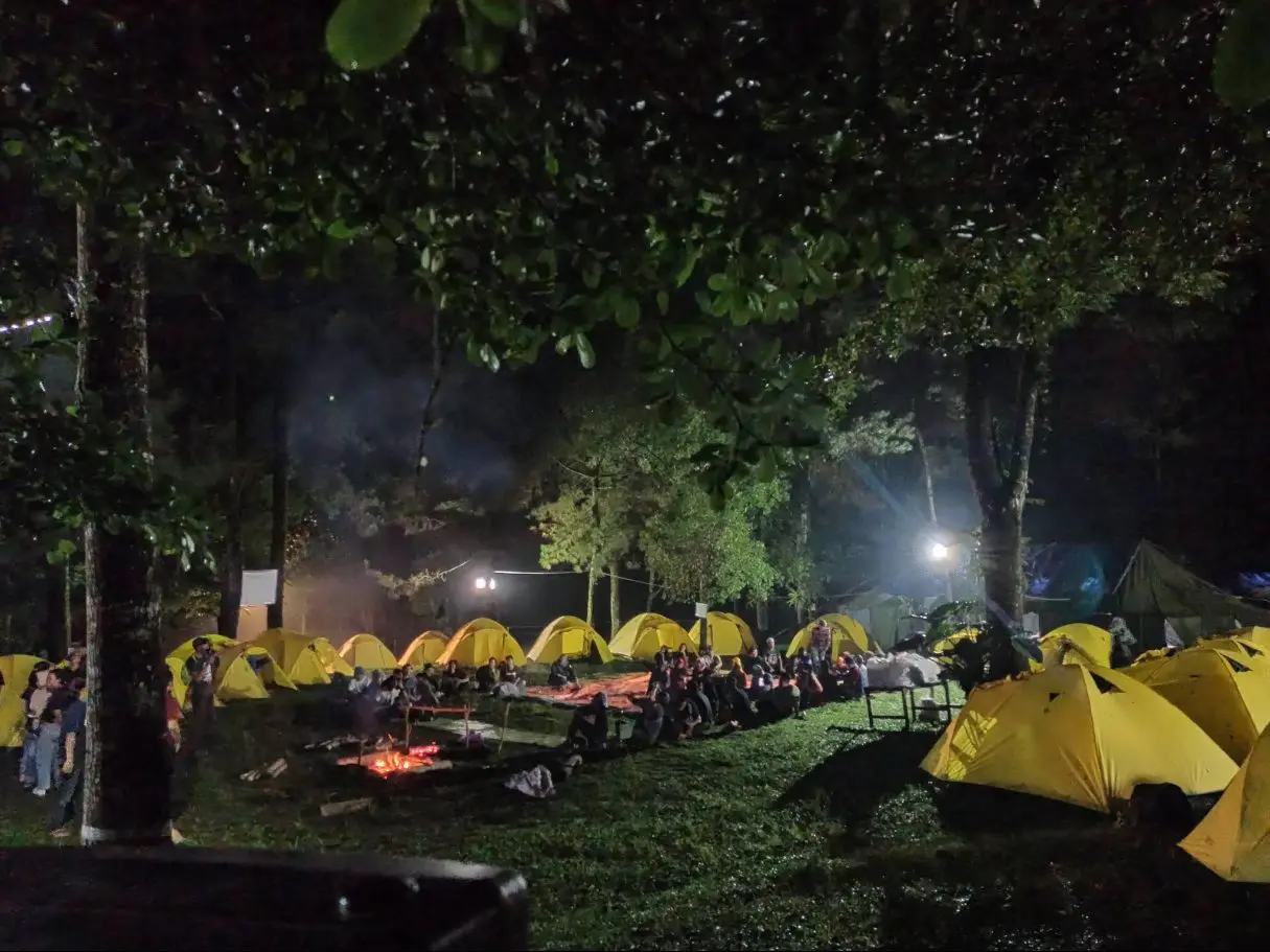 The camp glowing at night