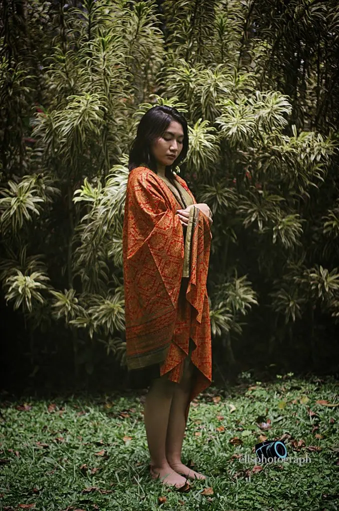 Portrait in batik among the ferns